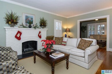 This room is gracious and open to the den.
