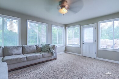 Sunroom/Family room overlooking fully fenced backy