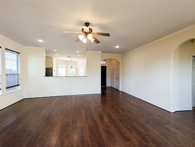 Family room has shiny wood floors