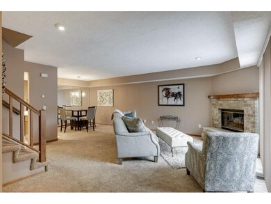 Cozy corner fireplace is focal point in the main l