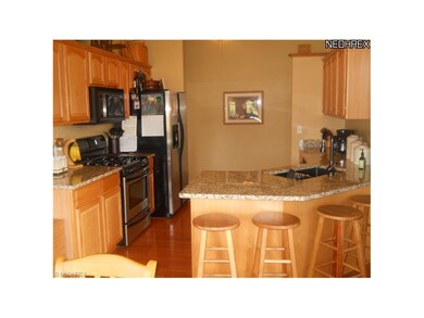 Oak kitchen with granite tops, stainless steel app