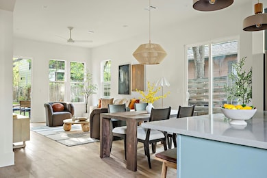 Dining room with light wood-style flooring and ce