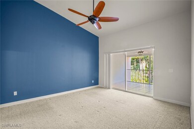 Unfurnished room with baseboards, carpet flooring,