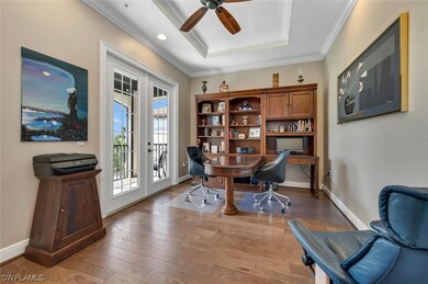 Spacious den features hardwood floors and private balcony.