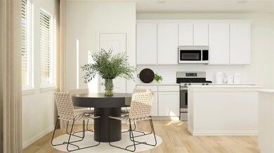 Kitchen with light hardwood / wood-style floors, a