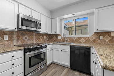 Your kitchen features modern stainless steel appli