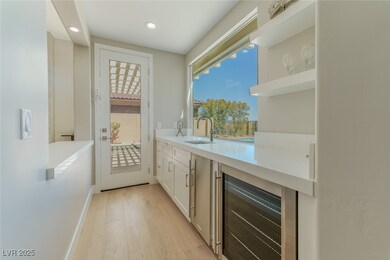 Bar featuring recessed lighting, Wolf ice maker an