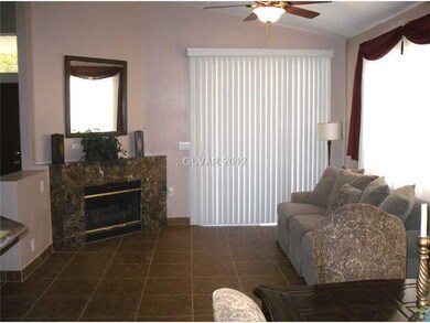 Living Room. living room, fireplace, and balcony d