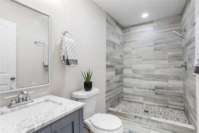 Two great tiled bedrooms  - one in the primary bedroom and one just outside of the kitchen and second bedroom.