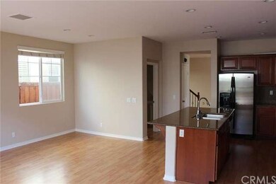 Breakfast nook, open kitchen.  Stainless refrigera