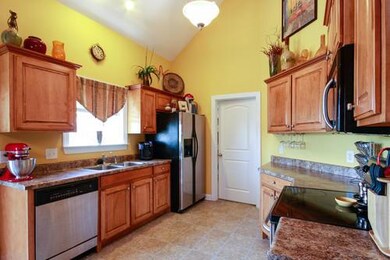 Huge Kitchen Includes Stainless Appliances: Electric Range, Microwave, Dishwasher and Refrigerator.