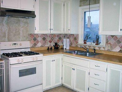 Kitchen. Ceramic tile backsplash,wood look counter
