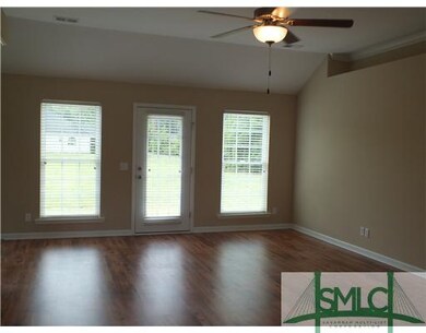 Living Room. opens to back yard, laminate  wood fl