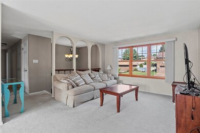 Pretty windows at the front of the home let in so