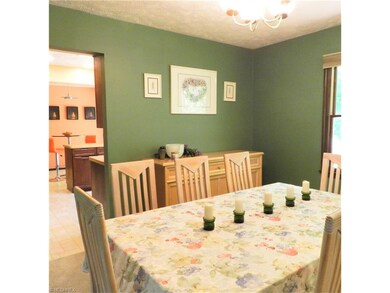 The dining room can easily seat 8.  Seen through t