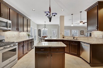Addition of recessed, pendant and chandelier lighting bring warmth and functionality to this space! Stainless appliances along with a composite granite sink & faucet were added to finish and complete the sleek look.