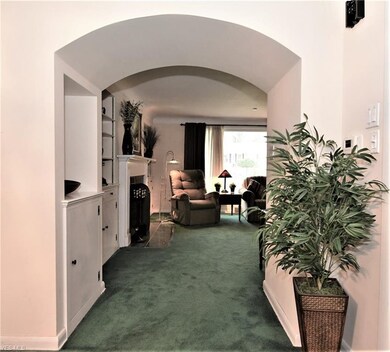 View from Living Room thru arched hall into Dining