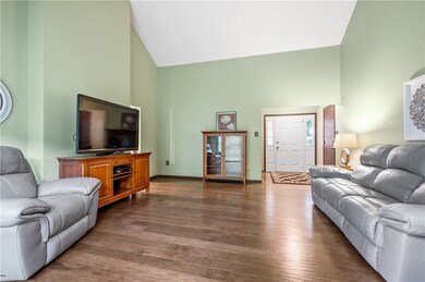 The living room offers engineered hardwood floors