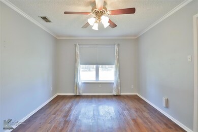 Unfurnished room featuring ceiling fan, ornamental
