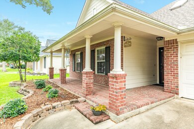 Front porch runs the length of the front of the home.  Great space for plants and a sitting area!
