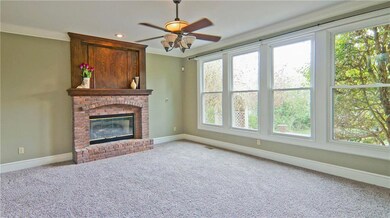 Family room with gorgeous fireplace and remote con