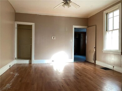 1st floor livingroom (looking at closet and kitchen entry)