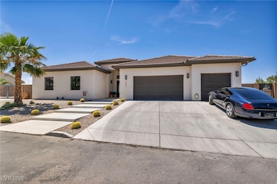 View of front of home with stucco siding, concrete