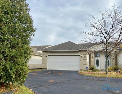 Private entrance with an attached 2 car garage.