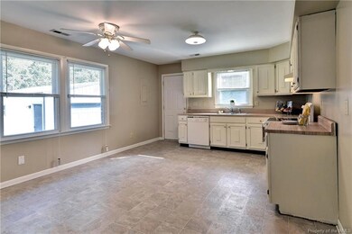 Spacious eat-in kitchen has laminate countertops a