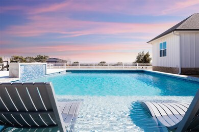 Pool at dusk featuring fence and a fenced in pool