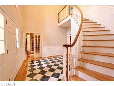 Foyer - 2-story foyer with curved stairway and mar