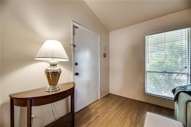 Entrance into living area with light, flooring thr