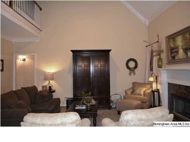 Den has fireplace, vaulted ceiling with fan, and i