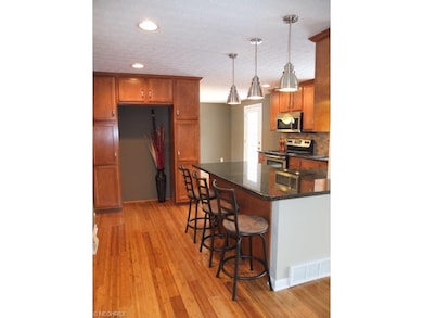 Remodeled kitchen with granite countertops and bre