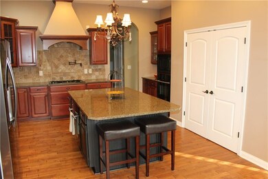 Kitchen has large island and over-sized pantry