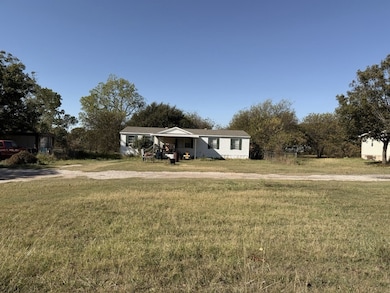 View of front of home featuring a front lawn