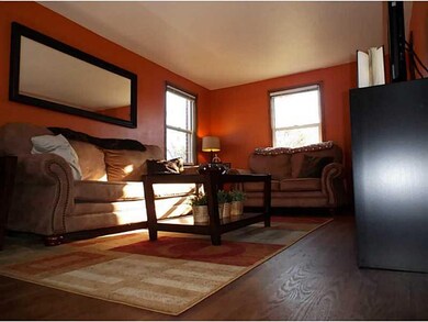 Living Room. Beautiful hardwood with plenty of nat