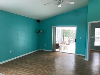 Living room is good sized with access to the pool 