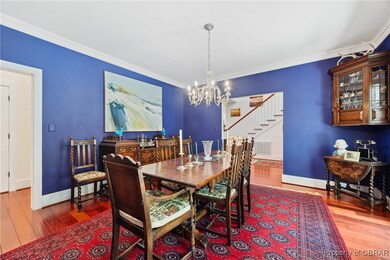 Dining room opening to foyer and hallway to kitche