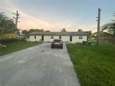 Single story home featuring driveway and a front yard