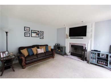 Family Room with wood burning fire place.