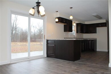 Kitchen off of Dining and Living Room-- easy to ge