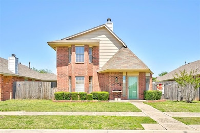 Traditional-style house with brick siding, a front