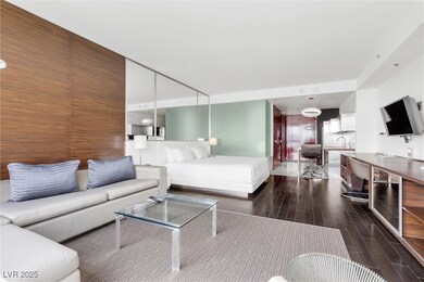 Living area featuring dark wood-style flooring