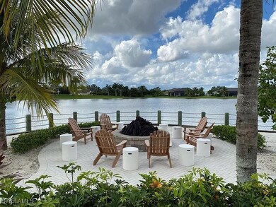 View of patio / terrace with a fire pit and a wate