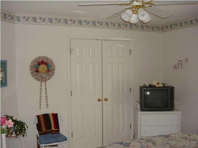 Additional bedroom with large closet and ceiling fan