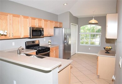 Large kitchen with breakfast nook and built in des