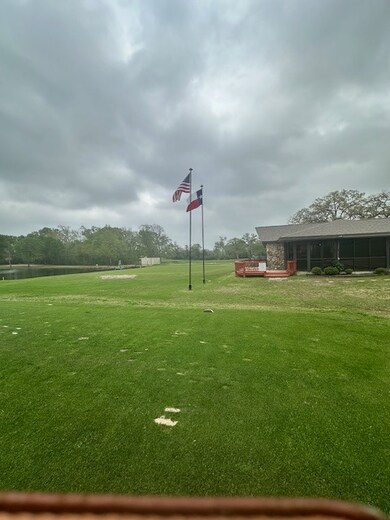 View of home's community featuring a lawn and a de