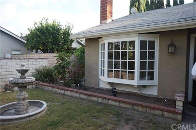 Private inner patio area with built-in planters and fountain.