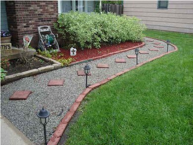 Cement walk way directly in front of home. So cham